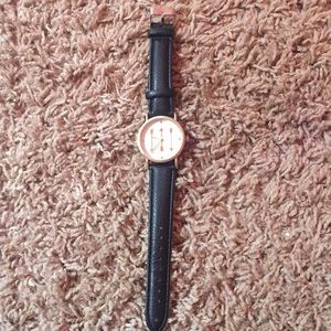 Back and gold arrow watch